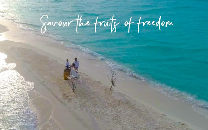 Couple Walking on the Beach at The Nautilus Maldives 