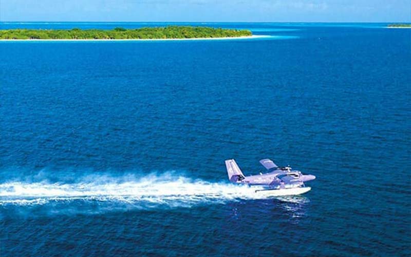 The Nautilus private seaplane gliding across the ocean
