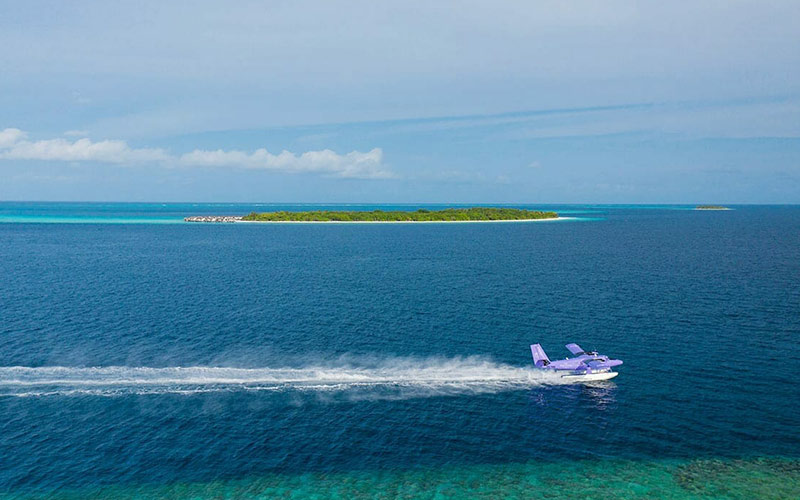 The Nautilus private seaplane gliding across the ocean