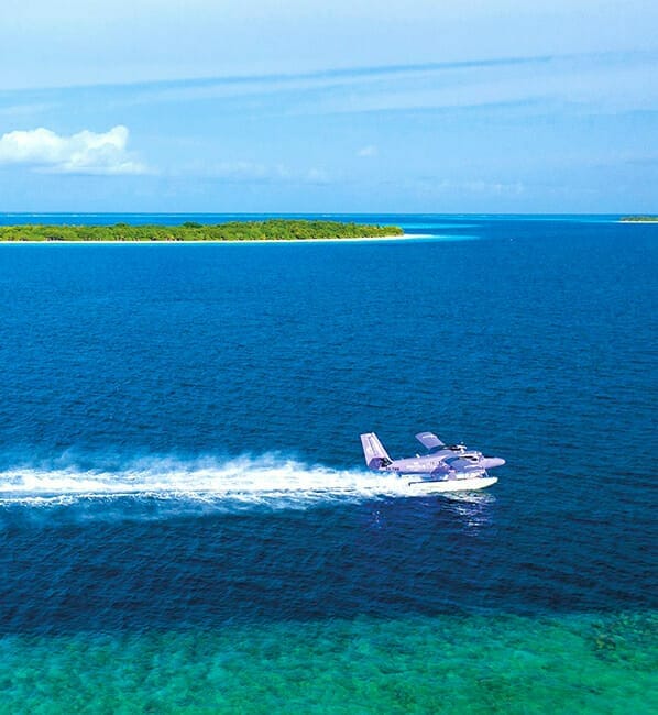 The Nautilus private seaplane gliding across the ocean