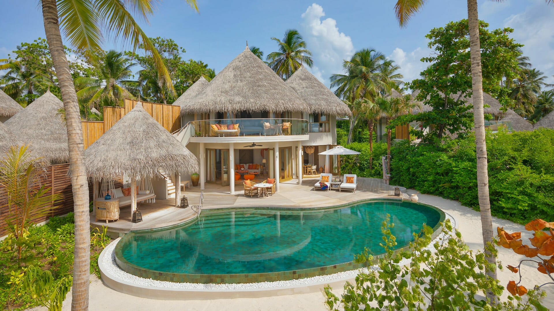 The Nautilus beach house — bohemian thatched villa with private pool among tropical palms, Baa Atoll Maldives