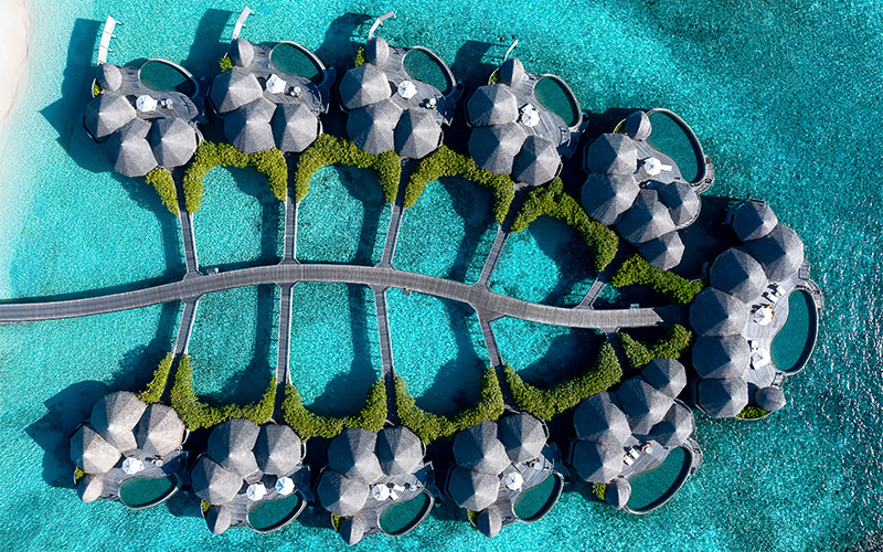 Top down aerial of the luxurious over water houses and residences at The Nautilus Maldives