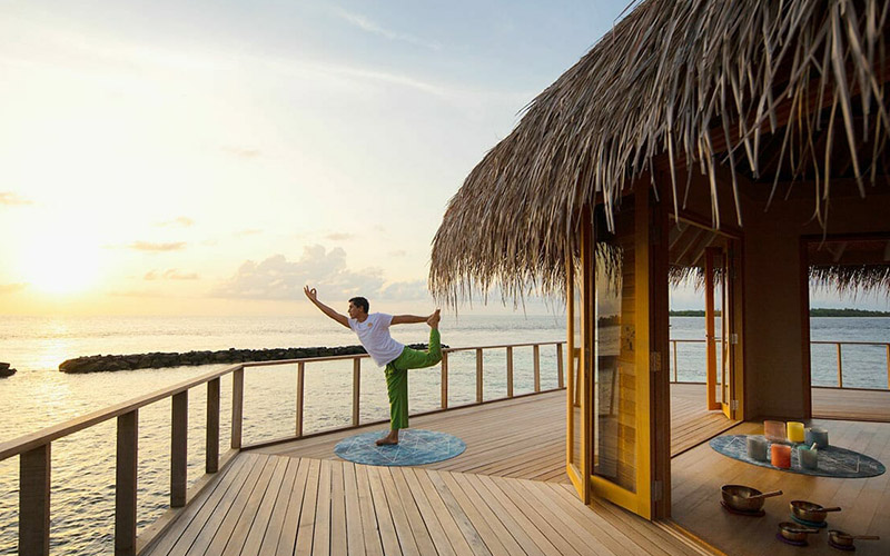 Man doing Yoga at the Yoga Pavilion at sunrise