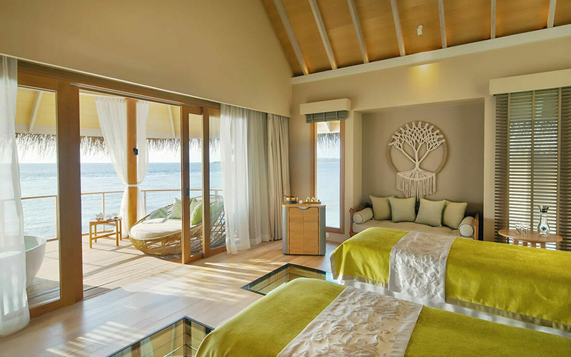 Interior of an overwater treatment room a the Solasta Spa, with stunning views of the ocean