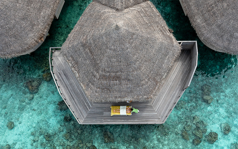 Top down aerial view of a person getting a treatment on the deck of the treatment room at Solasta Spa