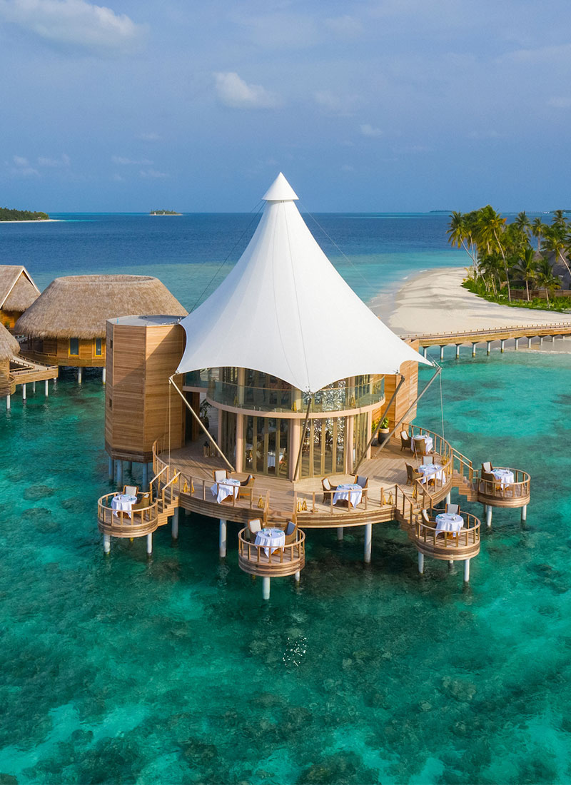 The Nautilus overwater dining pavilion — unscripted al fresco dining above turquoise reef lagoon, Baa Atoll Maldives
