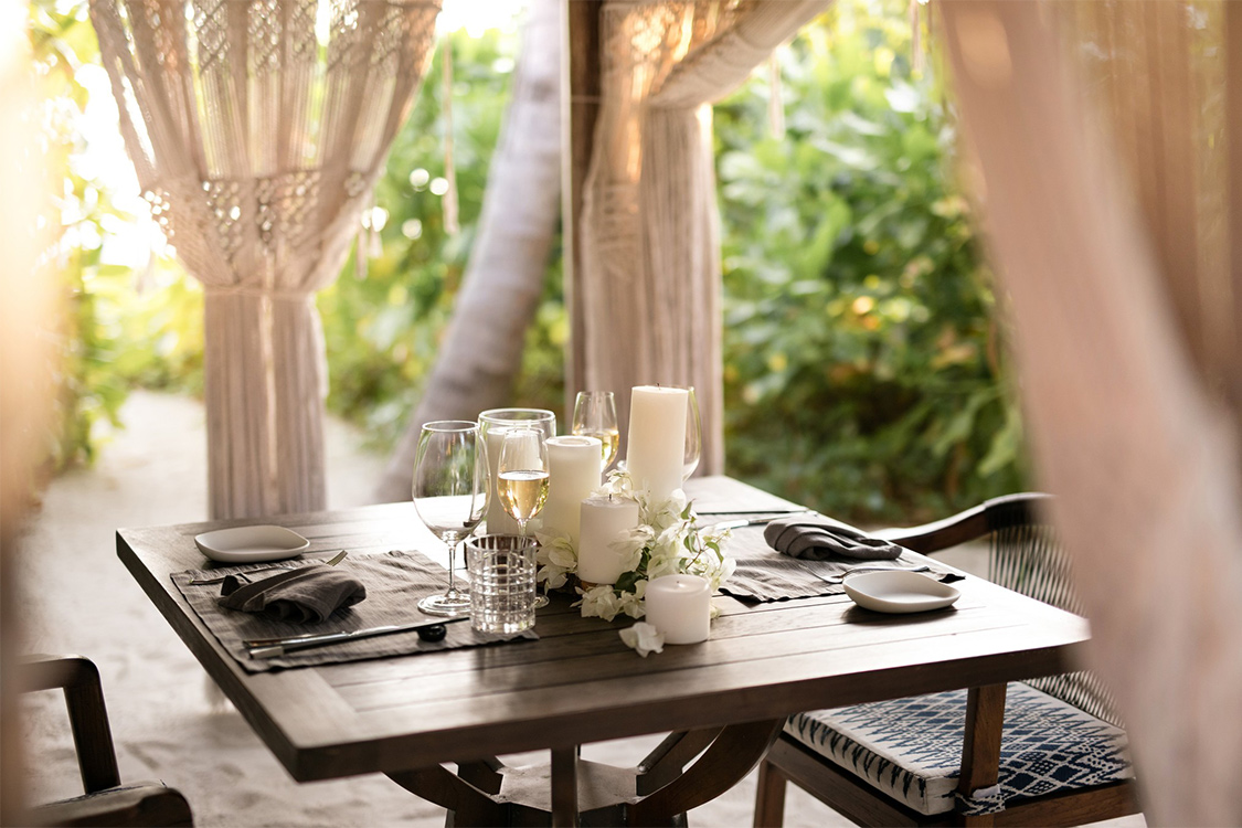 An intimate lunch setup at Ocaso, the beachside grill restaurant at The Nautilus Maldives