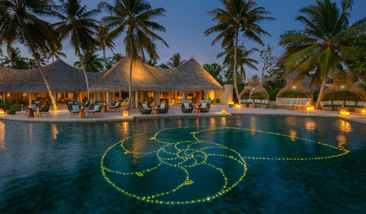 Naiboli, the poolside lounge at The Nautilus Maldives at twilight