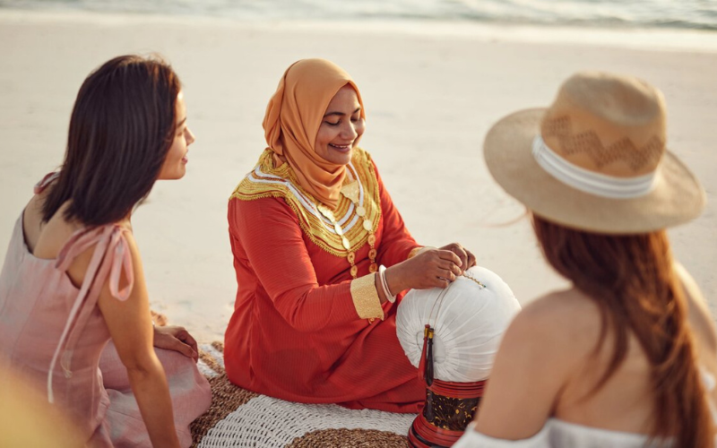 Local craftswoman demonstrating her craft on the beach at The Nautilus Maldives